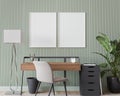 Poster frame mock up in home office, black and wooden desk in green room design Royalty Free Stock Photo