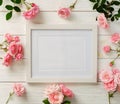 Poster frame mockup, top view, pink roses on white wooden background. Holiday concept. Flat lay. Copy space