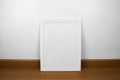 Poster Frame on wood floor Royalty Free Stock Photo