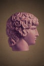 Poster with gypsum copy of ancient famous statue Antinous head on dark textured background. Plaster antique sculpture Royalty Free Stock Photo