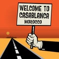 Poster in hand, text Welcome to Casablanca, Morocco