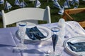 A Shabbat Table Setting with a Baby Bottle for the Infant who\'s name is on the poster at the back of the chair