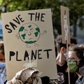 Poster with the inscription save the planet at FFF
