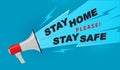 Poster with megaphone and text. Stay home, stay safe on a blue background. Covid-19 Coronavirus Quarantine Home Stay Campaign Royalty Free Stock Photo