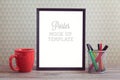 Poster mock up template with coffee cup on wooden table