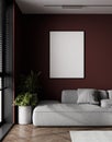 Poster mockup with black frame on empty dark red wall in living room interior with gray sofa, gray pillows and plants. 3D Royalty Free Stock Photo