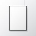Poster mockup hanging on light wall. White template with frame. Isolated picture close up. Empty blank with soft shadow