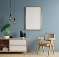 Poster mockup with vertical frames on empty dark blue wall in living room interior with armchair Royalty Free Stock Photo