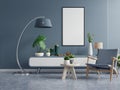 Poster mockup with vertical frames on empty dark green wall in living room interior with dark blue velvet armchair Royalty Free Stock Photo