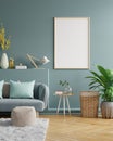 Poster mockup with vertical frames on empty dark green wall in living room interior with dark blue velvet sofa Royalty Free Stock Photo