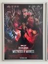 Poster for the movie Doctor Strange hangs on the wall in a frame
