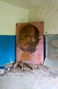 Poster with portrait of Lenin in abandoned building of former village council in resettled village of Pogonnoye in exclusion zone