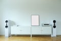 Poster on table in room.Poster Frame Mockup in white modern interior. Modern audio stereo system with white speakers on bureau in Royalty Free Stock Photo