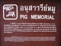 Poster in Thai and English at the Pig Memorial. Bangkok Pig Monument