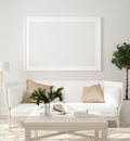 Poster, wall mockup in beige interior with white sofa, wooden table and plants, Scandinavian style Royalty Free Stock Photo