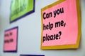 A poster on the wall that reads `Can you help me please ?` Royalty Free Stock Photo