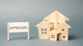 A poster with the word Appraisal and a miniature wooden house. Real estate. Rate the property / home. Evaluation. Apartments, Royalty Free Stock Photo