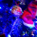 Posterised Santas hat on Christmas tree and blue light