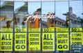 Posters advertising a Paperchase store closing down sale. Woking, Surrey.