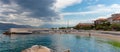 Postira, Croatia August 2020 Beach in the town of Postira on the island of Brac, people enjoying a hot summer day swimming in