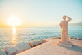 POSTIRA, CROATIA - JULY 12, 2017: Famous monument of person looking into a horizon in a small town Postira - Croatia, Brac island