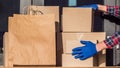 The postman brought several boxes of parcels to the doorstep of the house Royalty Free Stock Photo