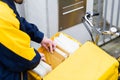 Postman delivering letters to mailbox of recipient Royalty Free Stock Photo