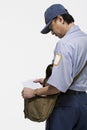 Postman holding a letter