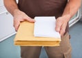 Postman holding letters