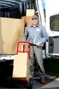 Postman with parcel box. Royalty Free Stock Photo