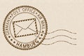 Postmark. Round brown stamp on beige background. Hamburg, Germany