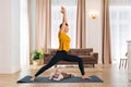 Happy mom practicing yoga with her little baby at home Royalty Free Stock Photo