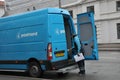 POSTNORD DELIVERY MAIL AND PACKET MAN Royalty Free Stock Photo