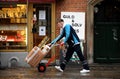 POSTNORD DELIVERY  MAN WITH PACKETS Royalty Free Stock Photo