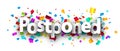Postponed word over colorful cut out ribbon confetti background