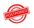 Postponed word written on red rubber stamp
