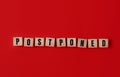 Postponed - words from wooden blocks with letters, postponed concept, top view background.