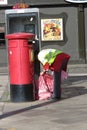 Postwoman collecting mail