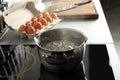 Pot with boiling water on electric stove Royalty Free Stock Photo