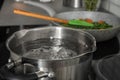 Pot with boiling water on electric stove in kitchen Royalty Free Stock Photo