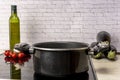 a pot of boiling water on an electric stove in the kitchen Royalty Free Stock Photo