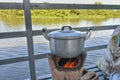 Pot on a charcoal stove.