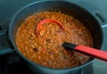 A pot of chilli beef soup with red beans, cooking on a stove Royalty Free Stock Photo