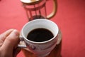 A pot of coffee holding by hand Royalty Free Stock Photo