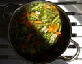 Pot with cooked vegetables and broth inside Royalty Free Stock Photo