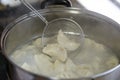 A pot of cooking dumplings