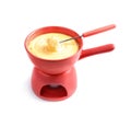 Pot of delicious cheese fondue and fork with bread on white i Royalty Free Stock Photo