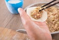 A pot of dumpling stuffing and two hands are making dumplings Royalty Free Stock Photo
