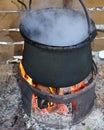 Pot with the fire and smoke Royalty Free Stock Photo