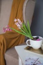 Pot with a flower on the table